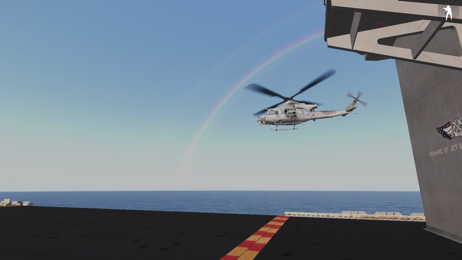 A Huey landing on a carrier deck beneath a rainbow, 2017